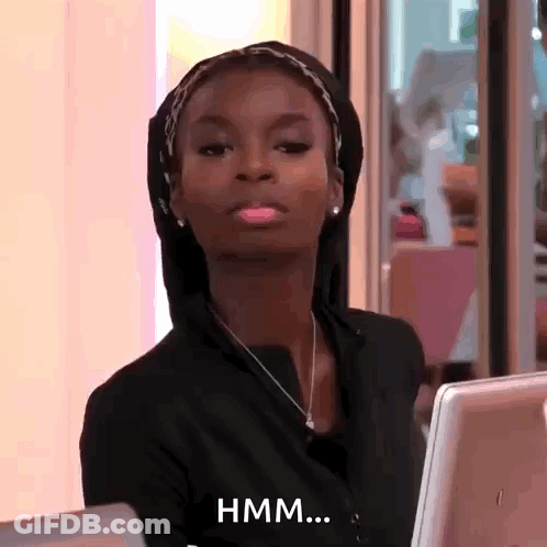 Woman In Black Hoodie Says Hmm At Laptop GIF