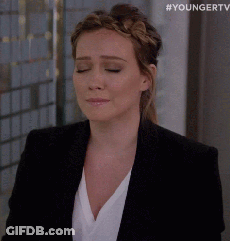Woman In Black Jacket And Braided Headband Eyes Closed GIF