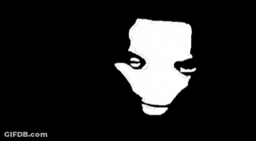 Woman In Black Jacket And Hoop Earrings Making Heart GIF