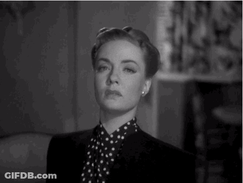 Woman In Black Jacket And Polka Dot Shirt GIF