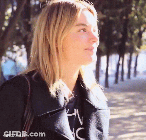 Woman In Black Jacket And Shirt With NC GIF