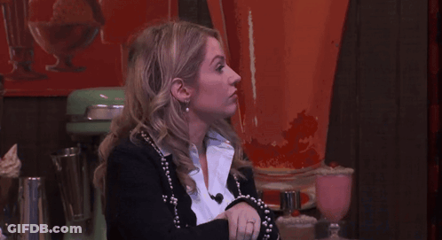 Woman In Black Jacket And White Shirt Looking Up GIF