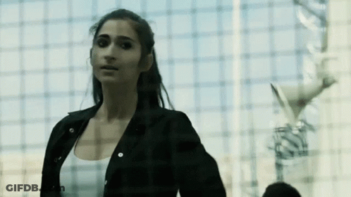 Woman In Black Jacket And White Tank Top GIF