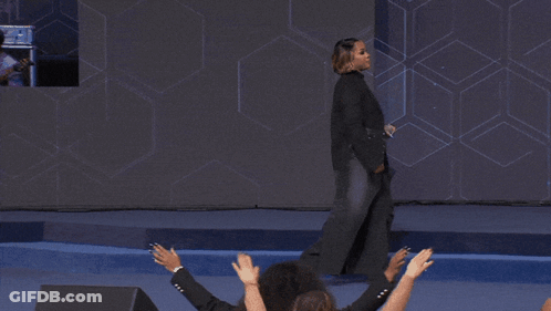 Woman In Black Jacket Holding Microphone GIF