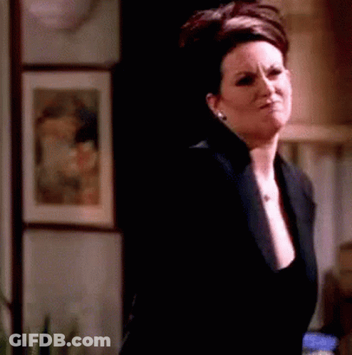 Woman In Black Jacket In Dark Room GIF