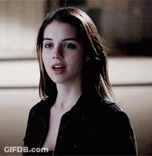 Woman In Black Jacket Looking At Camera GIF