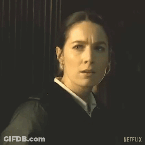 Woman In Black Jacket Looking At Camera GIF
