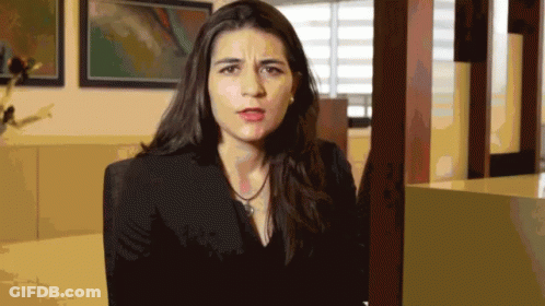 Woman In Black Jacket Making Face GIF