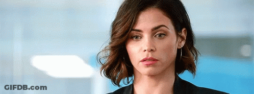 Woman In Black Jacket Making Serious Face GIF