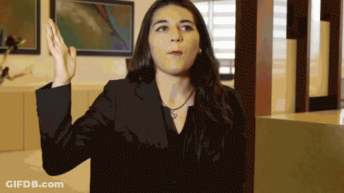 Woman In Black Jacket Raising Hand GIF