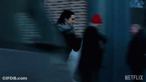 Woman In Black Jacket Running Past Blue Door Netflix GIF