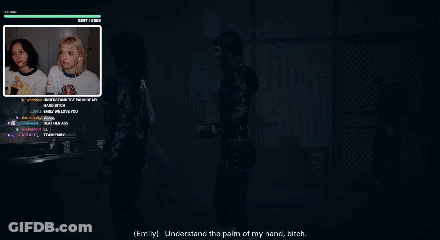 Woman In Black Jacket Standing In Front Of Computer Monitor GIF