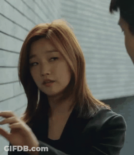Woman In Black Jacket Talking To Woman GIF