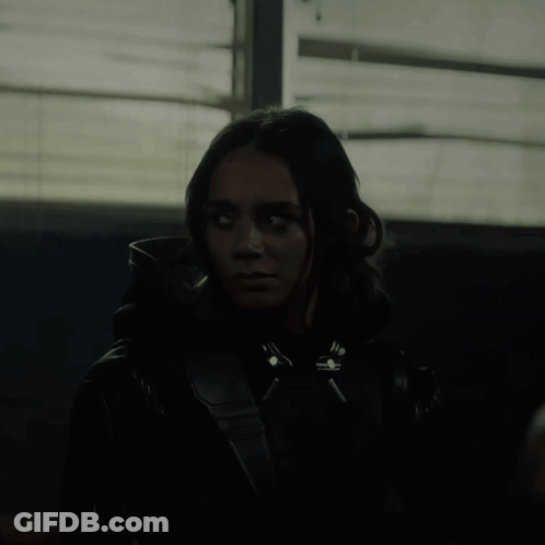 Woman In Black Jacket With White Eyes GIF