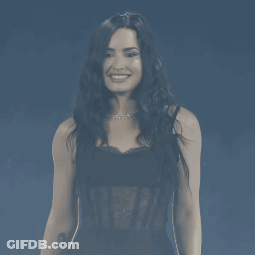 Woman In Black Lace Top Smiling GIF