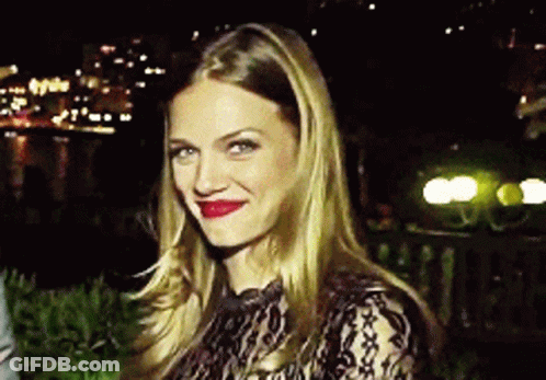 Woman In Black Lace Top Smiling GIF
