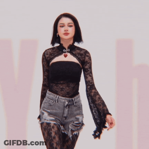 Woman In Black Lace Top With Heart Necklace GIF