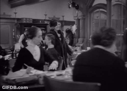 Woman In Black Leather Jacket And Gloves GIF