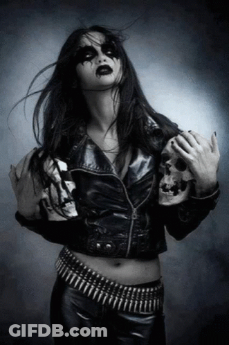 Woman In Black Leather Jacket Holding Skull GIF