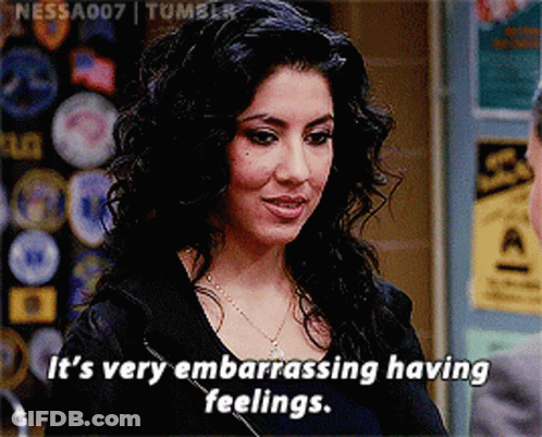 Woman In Black Leather Jacket Standing At Desk GIF