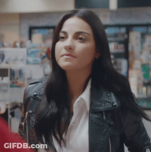 Woman In Black Leather Jacket Standing In Store GIF