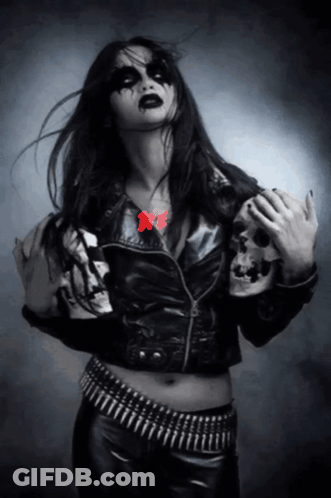 Woman In Black Leather Jacket With Skull Sleeve GIF