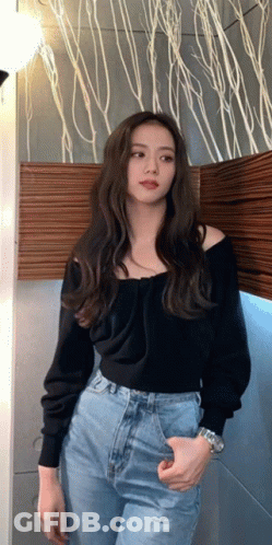 Woman In Black Off-Shoulder Sweater And Blue Jeans GIF