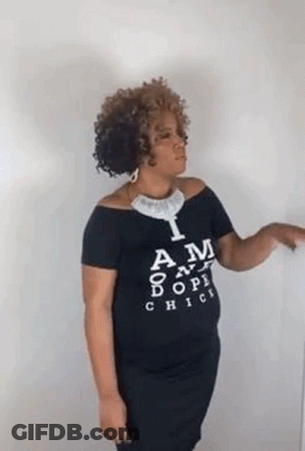 Woman In Black Off-Shoulder T-Shirt Pointing GIF