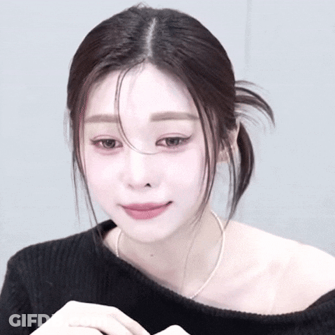 Woman In Black Off-Shoulder Top And Silver Necklace GIF