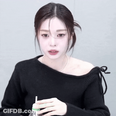 Woman In Black Off The Shoulder Sweater Drinking GIF