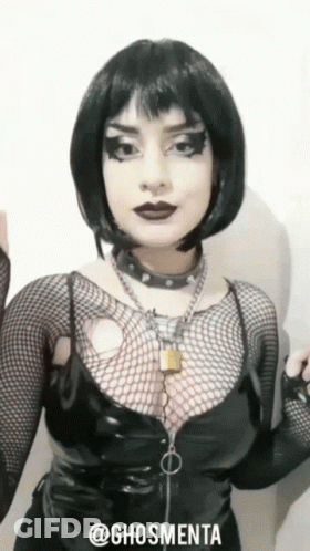 Woman In Black Outfit With Hashtag @Ghosmenta GIF