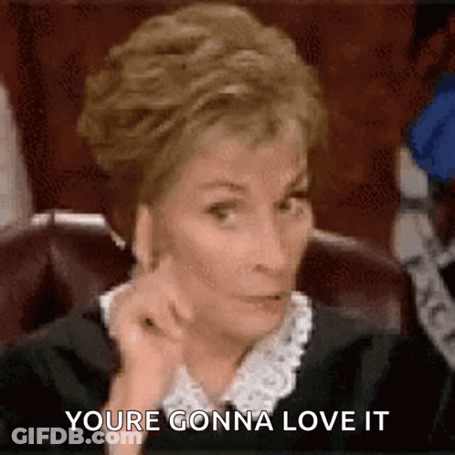 Woman In Black Robe Sitting At Table GIF