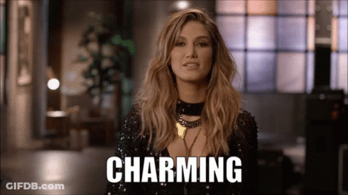 Woman In Black Sequined Top With Charming Sign GIF