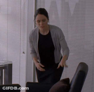 Woman In Black Shirt And Grey Cardigan GIF