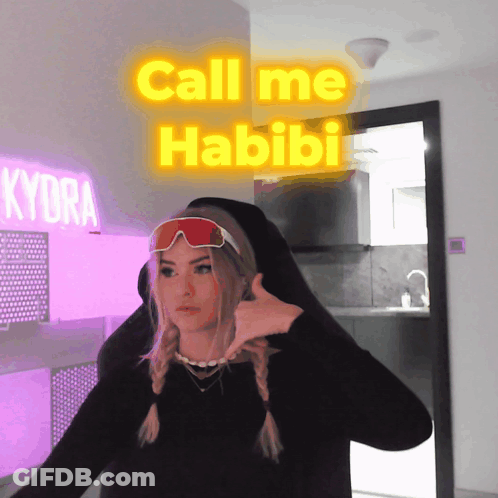 Woman In Black Shirt And Red Goggles Saying Call Me Habibi GIF