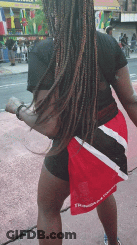 Woman In Black Shirt And Red Shorts Saying Trinidad And Tobago GIF