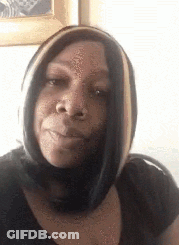 Woman In Black Shirt And Scarf Making Funny Face GIF
