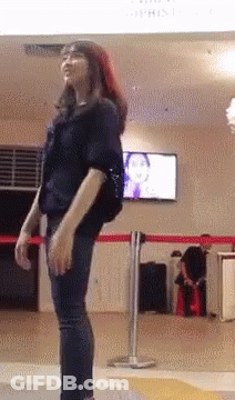 Woman In Black Shirt By Atrium Sign GIF