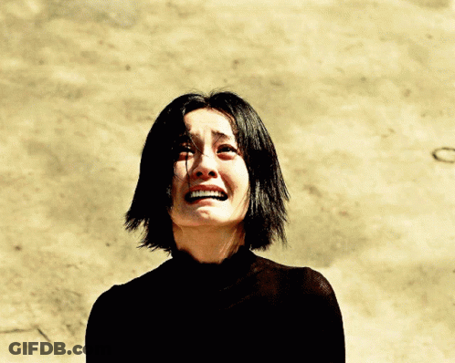 Woman In Black Shirt Crying With Smile GIF