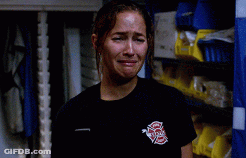 Woman In Black Shirt Fire Department Logo GIF
