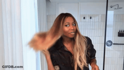 Woman In Black Shirt Hair Blowing In Wind GIF
