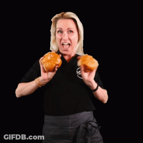 Woman In Black Shirt Holding Two Hamburger Buns GIF