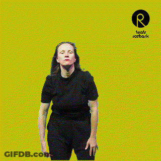 Woman In Black Shirt In Front Of Teatro Rozbark Logo GIF
