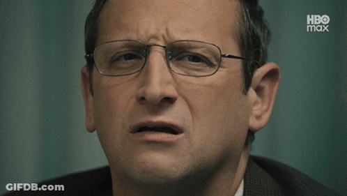 Woman In Black Shirt Making Face GIF