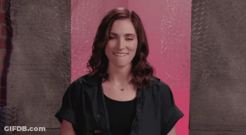 Woman In Black Shirt Making Face GIF