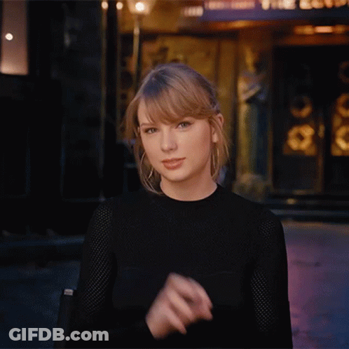 Woman In Black Shirt Making Funny Face With Hands GIF