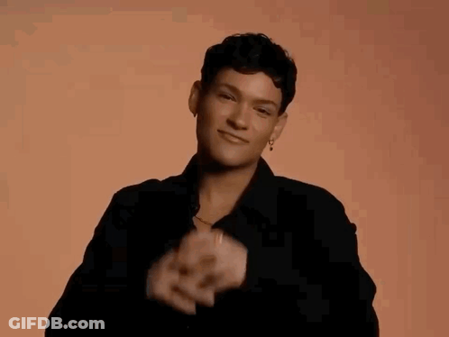 Woman In Black Shirt Making Heart With Hands GIF