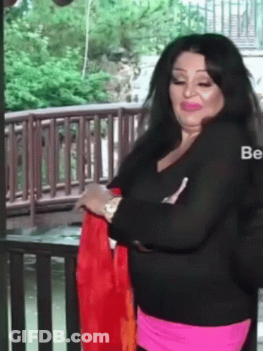 Woman In Black Shirt, Pink Skirt Wooden Railing GIF