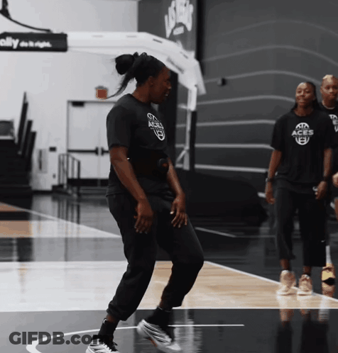 Woman In Black Shirt Saying Aggies Dancing On Court GIF
