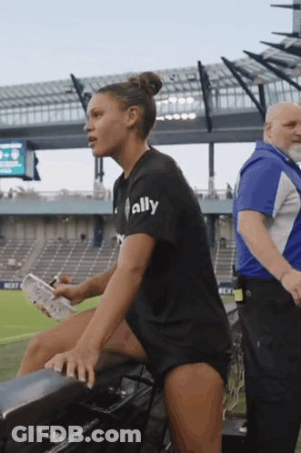 Woman In Black Shirt Saying Ally In Stadium GIF